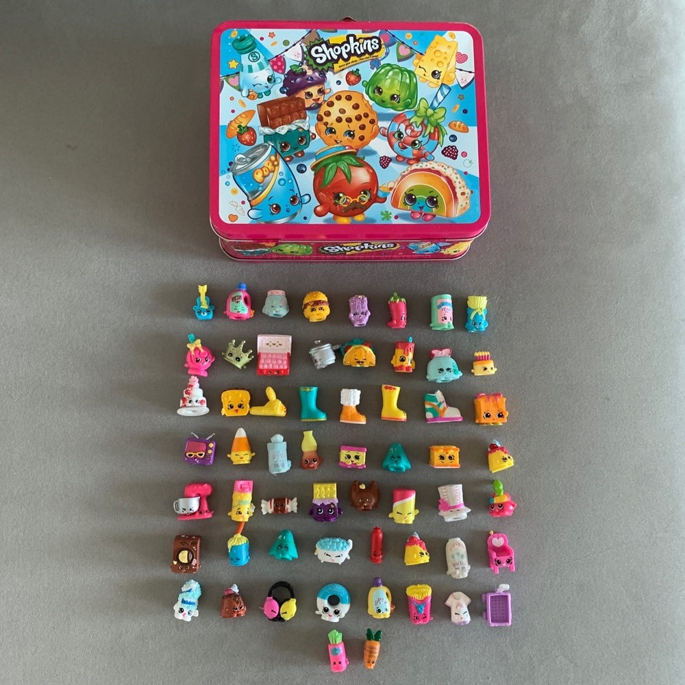 Assorted Shopkins with Shopkins tin lunchbox.